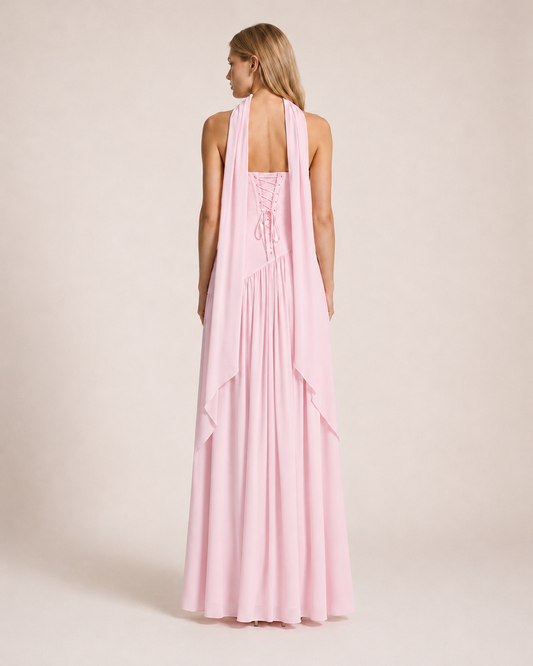 Luna Rosa Maxi Dress back view featuring a lace-up corset back, flowing scarf detail and full-length skirt in soft blush pink