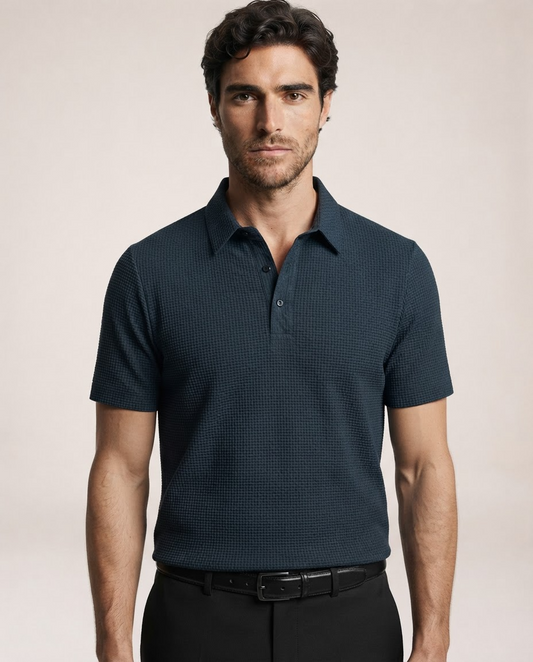 Vinicius navy blue polo shirt showing textured fabric and button collar
