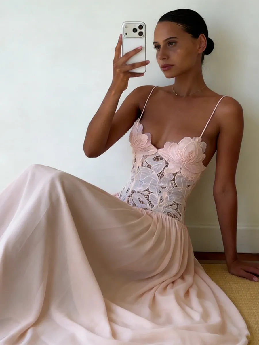 Customer wearing Roséa Maxi Dress seated indoors in blush pink