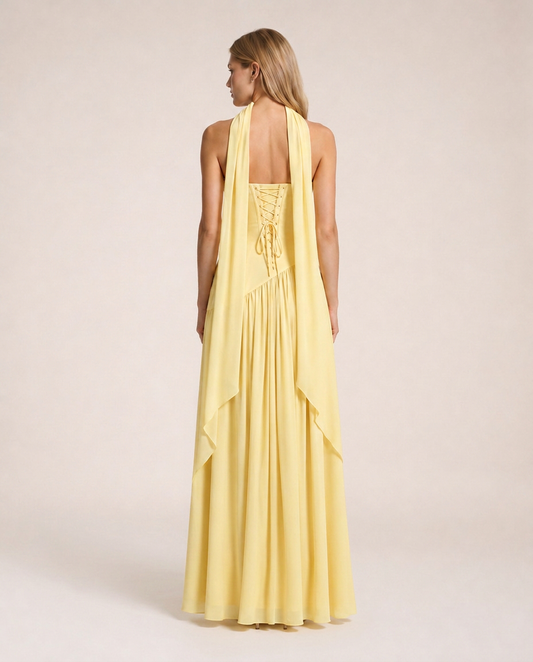 Limone di Amalfi Maxi Dress back view featuring lace-up corset closure, cascading scarf panels and fluid floor-length silhouette in soft lemon yellow