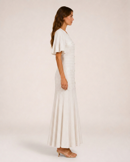 Sole Knit Midi Dress side view white flowing knit dress silhouette