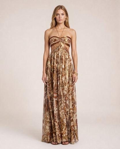 Terra di Siena Maxi Dress featuring a brown Mediterranean-inspired print, bandeau neckline, open back with halter tie and flowing full-length skirt