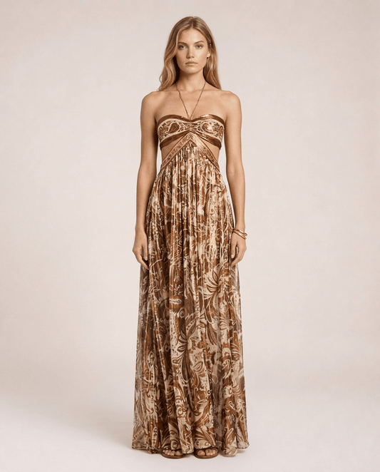 Terra di Siena Maxi Dress featuring a brown Mediterranean-inspired print, bandeau neckline, open back with halter tie and flowing full-length skirt