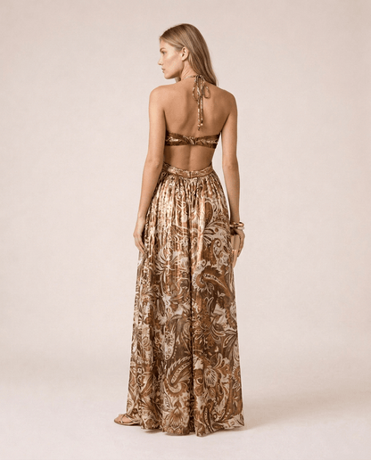 Terra di Siena Maxi Dress back view featuring a brown Mediterranean-inspired print, bandeau neckline, open back with halter tie and flowing full-length skirt