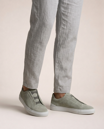 Vittorio light grey suede slip-on sneakers worn with linen trousers relaxed italian summer resort look side detail