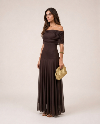 Side view of the Alessia Maxi Dress in chocolate brown with a fitted bodice and flowing sheer maxi skirt