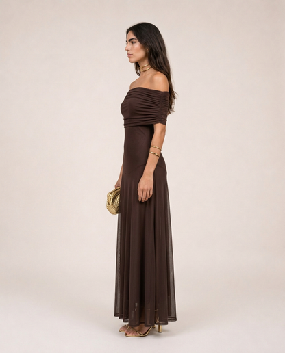 Side view of the Alessia Maxi Dress in chocolate brown with a fitted bodice and flowing sheer maxi skirt