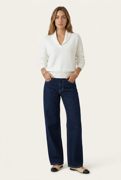 Menielle Antonine Sweater in white, knit sweater with a V-shaped shawl collar, second front view with jeans and ballet flats