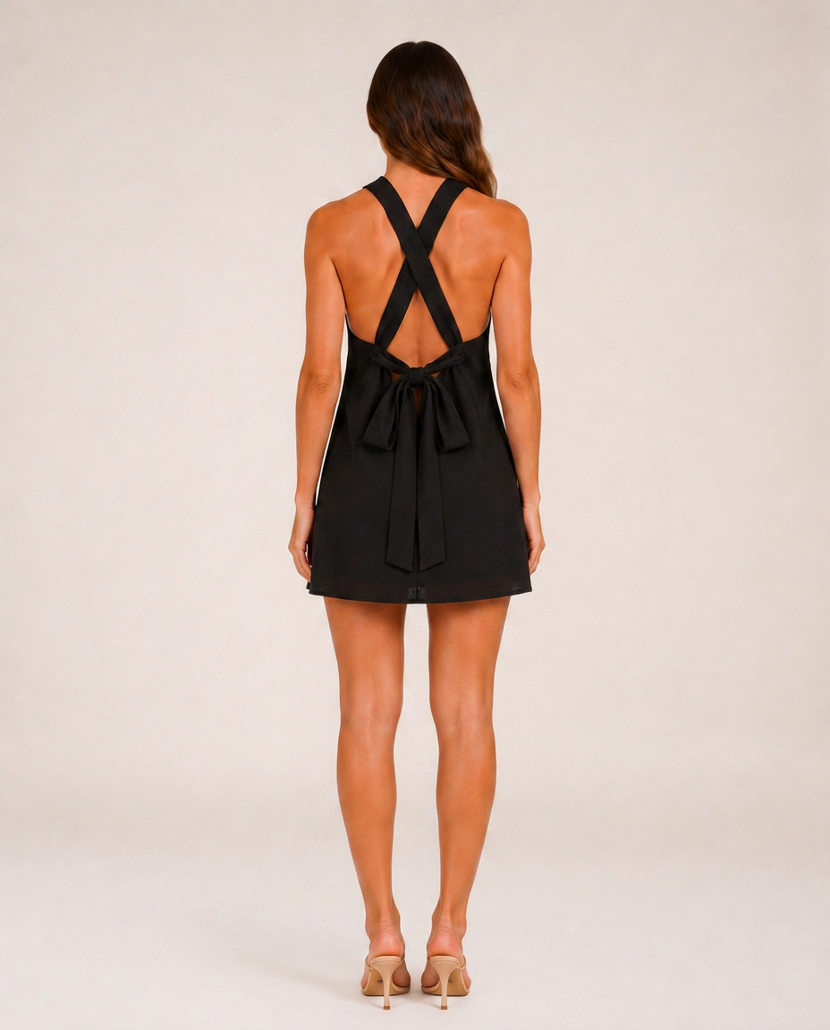 Marbella Noir & Blanc Mini Dress rear view showing crossed straps and open back