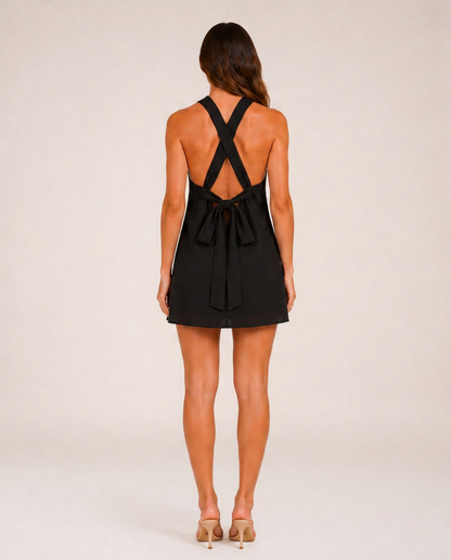 Marbella Noir & Blanc Mini Dress rear view showing crossed straps and open back