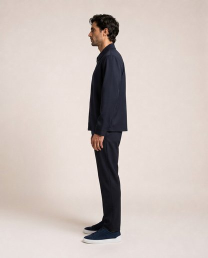 Nilo navy jacket side view showing relaxed silhouette and straight hem