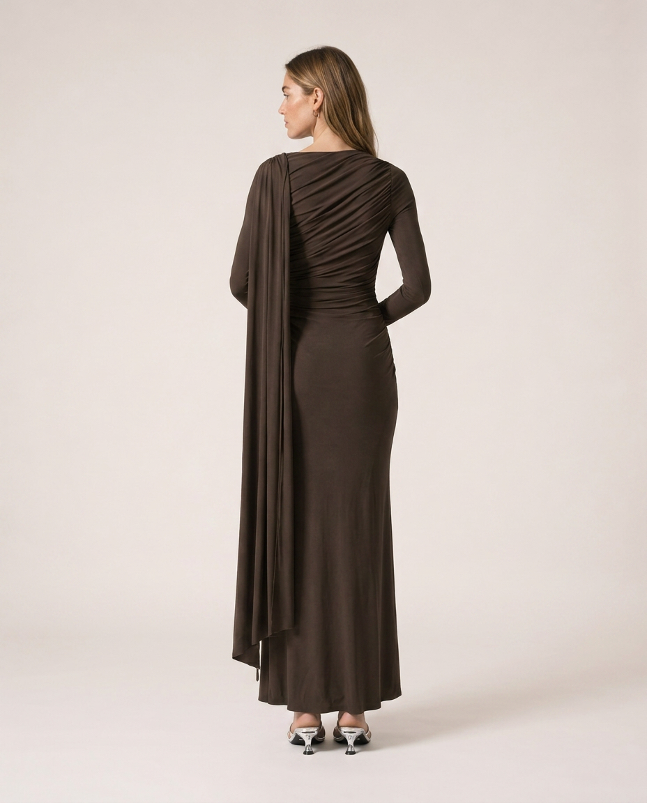 Back view of Vittoria Maxi Dress in dark brown with gathered draping and long cape detail