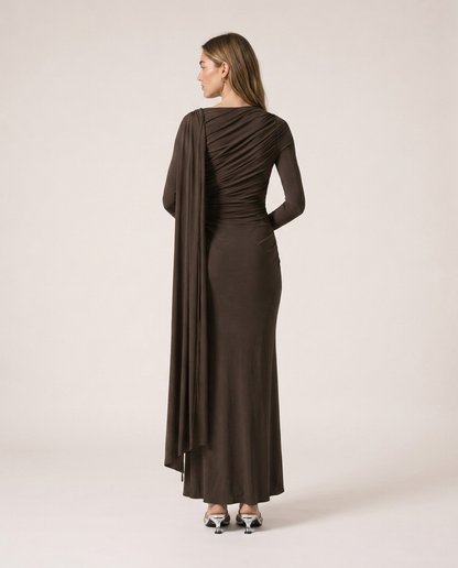 Back view of Vittoria Maxi Dress in dark brown with gathered draping and long cape detail