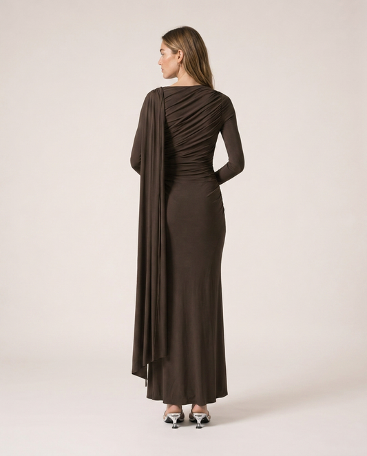 Back view of Vittoria Maxi Dress in dark brown with gathered draping and long cape detail
