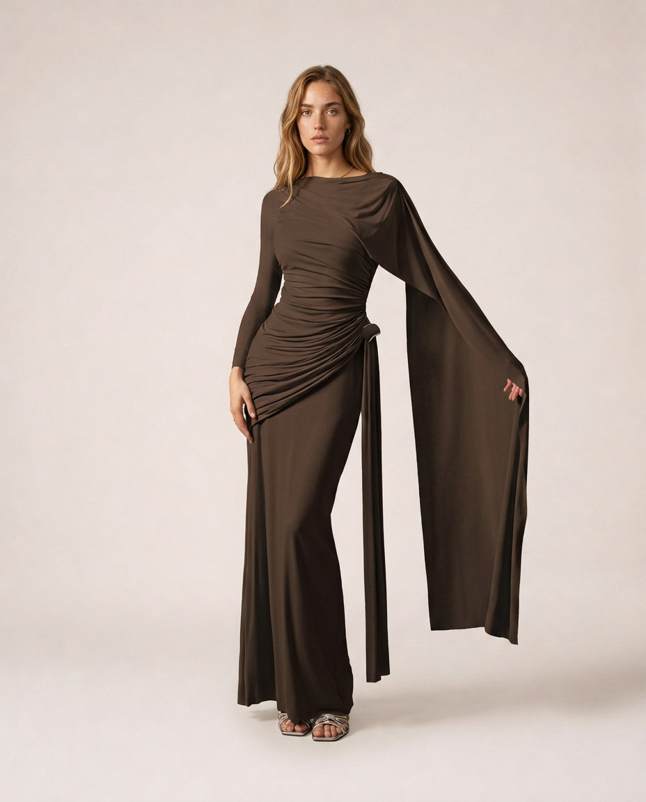 Vittoria Maxi Dress in dark brown with long sleeves, draped ruching and flowing cape detail