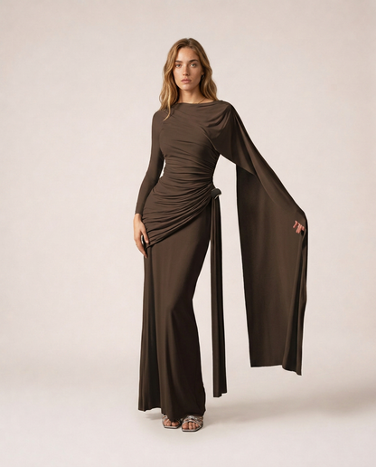 Vittoria Maxi Dress in dark brown with long sleeves, draped ruching and flowing cape detail