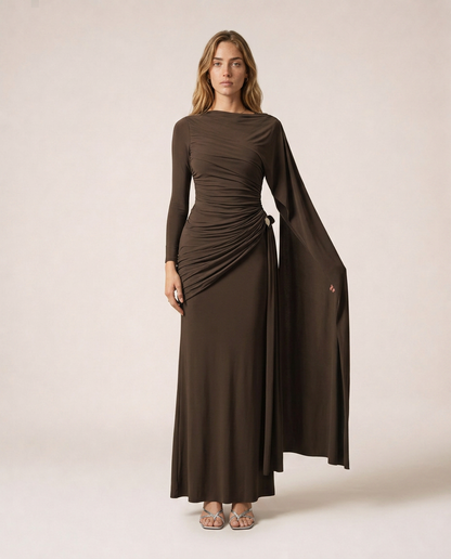 Vittoria Maxi Dress in dark brown with asymmetrical draping, long sleeves and floor-length silhouette
